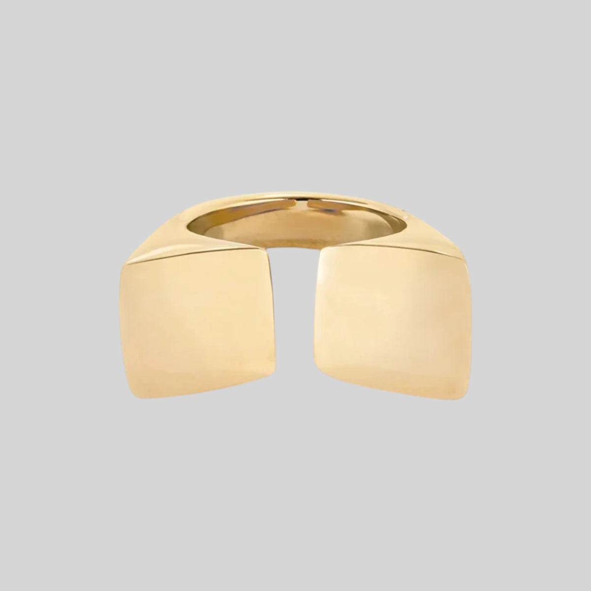 Gold architectural geometric open statement ring showing high-shine metallic finish
