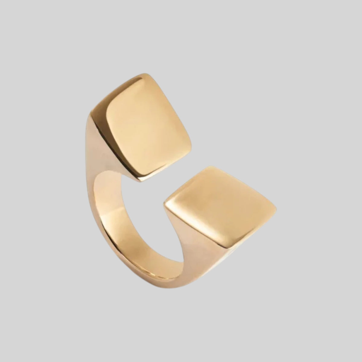Gold architectural geometric open statement ring showing high-shine metallic finish