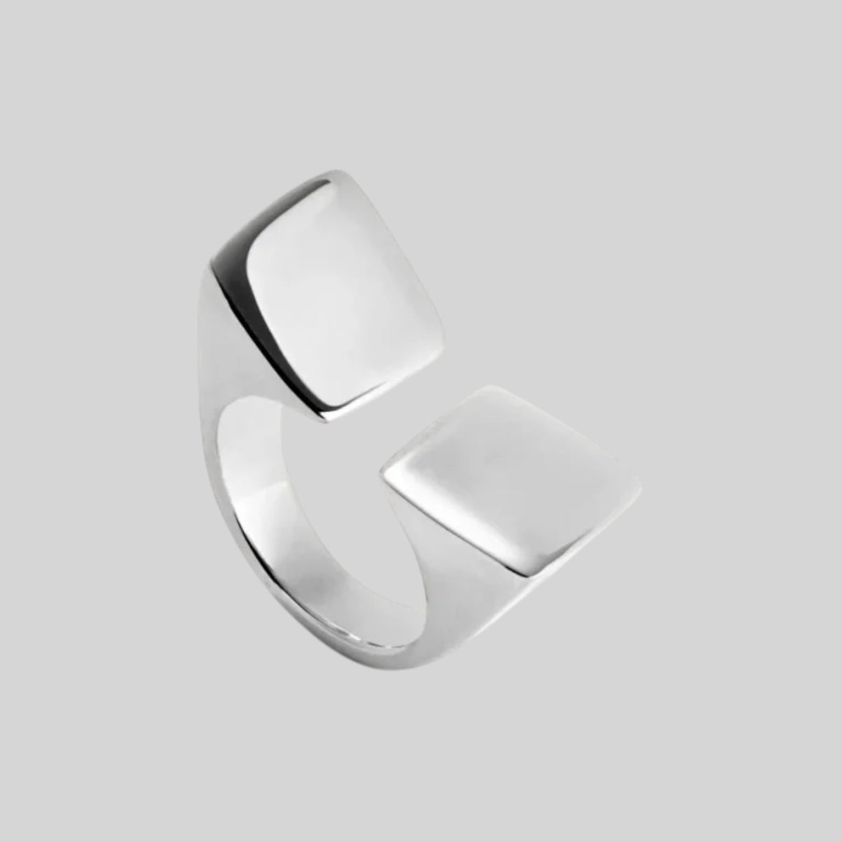 Silver architectural geometric open statement ring on neutral background by Modernist Mood