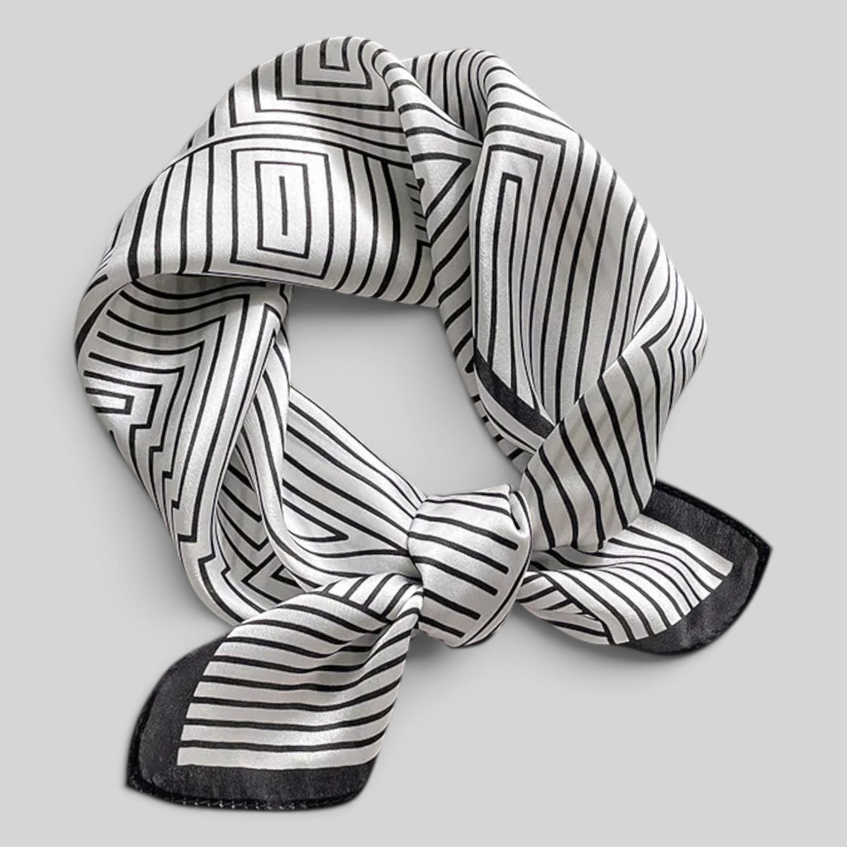 Square silk neckerchief folded diagonally showing geometric line design