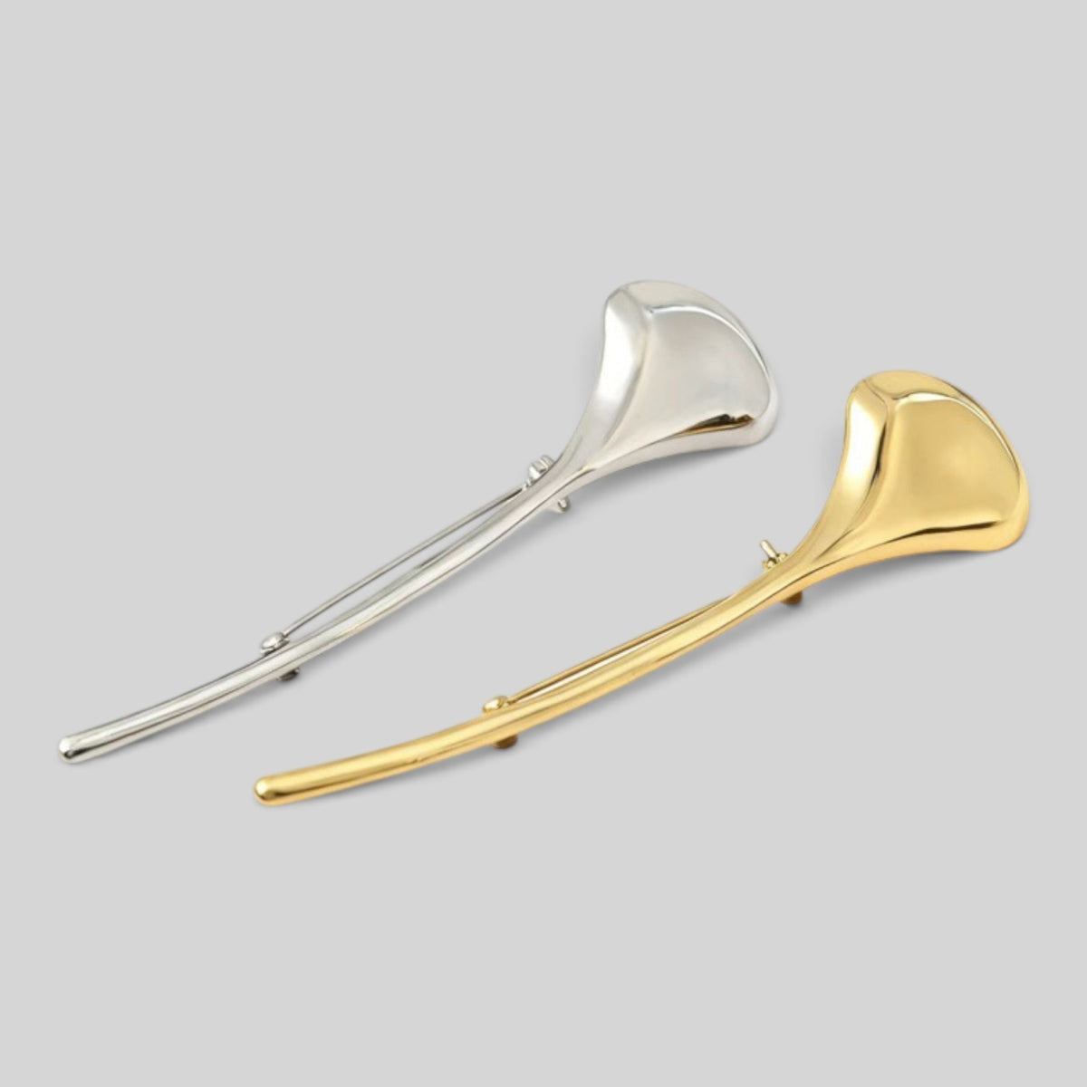 Minimalist silver and gold metallic ginkgo leaf brooches by Modernist Mood