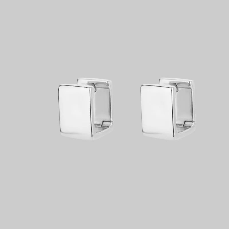 Pair of silver square cufflinks on a white background