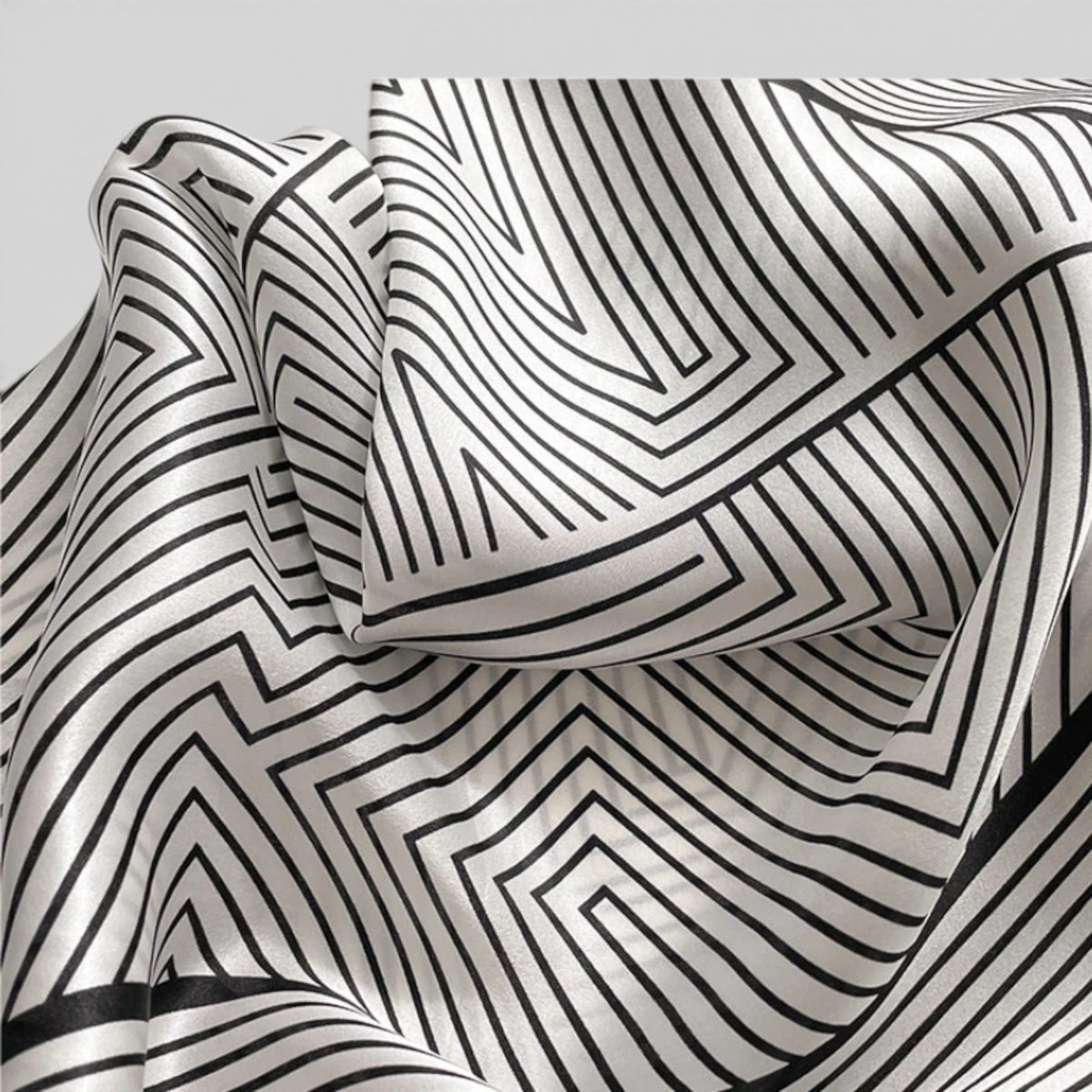 Close-up detail of smooth natural silk fabric with fine geometric stripe pattern