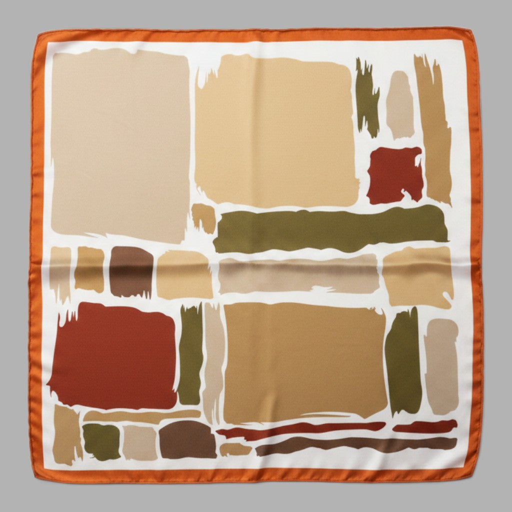A square silk scarf featuring an abstract geometric pattern with blocks and brushstrokes in beige, brown, olive green, and terracotta red, finished with a solid orange border, shown flat against a neutral gray background.