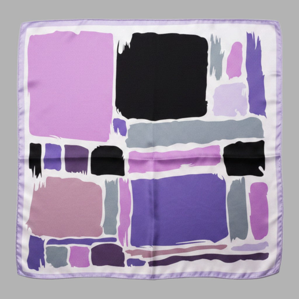 A square silk scarf featuring an abstract art print with blocks and brushstrokes in purple, pink, black, gray, and white, finished with a light purple satin border.